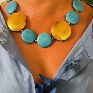 New.  Gold tone and stone natural